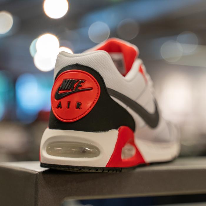 Close up of white, red and black Nike trainer