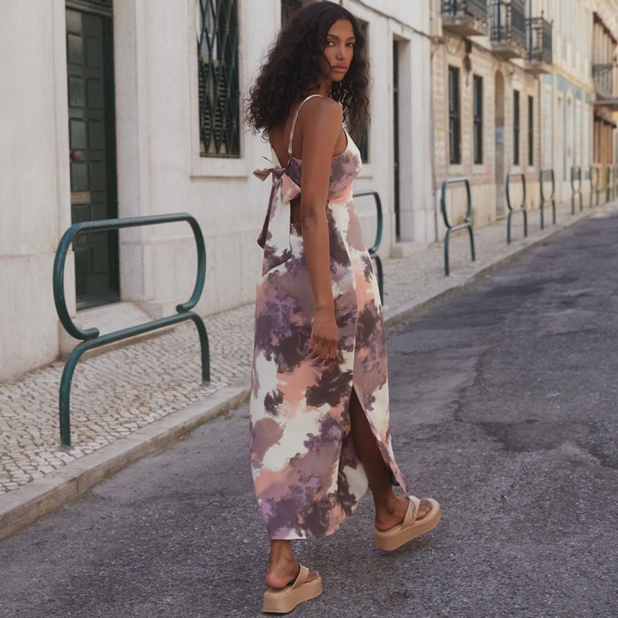 Woman in brown maxi dress and platform sandals